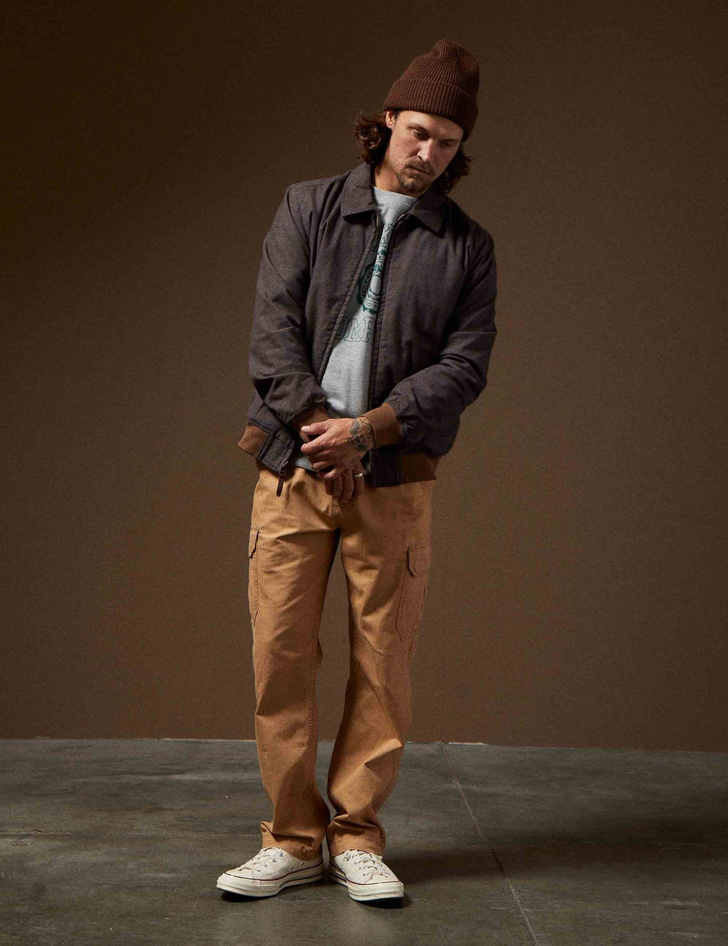 Black mechanic zip jacket with stand collar and front zipper, worn by model
