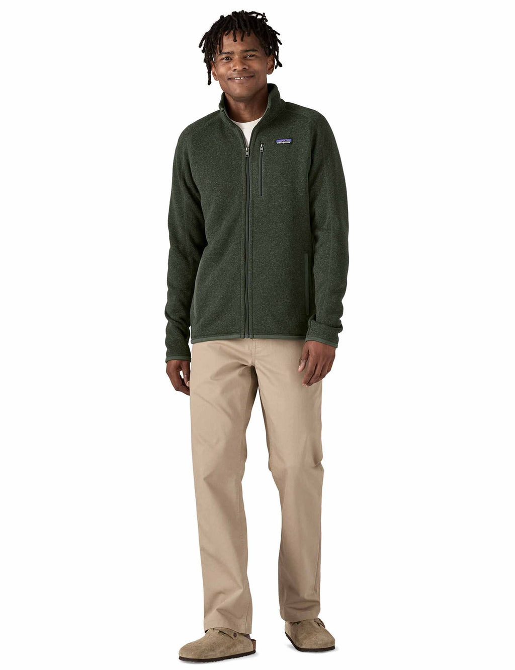 Better Sweater fleece jacket, dark green full-zip with stand collar; worn with beige pants
