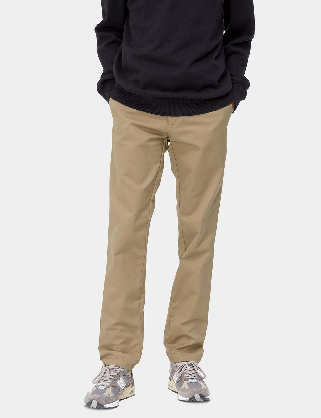 Beige leather Sid pant on model, straight leg with front crease and cuffed hem