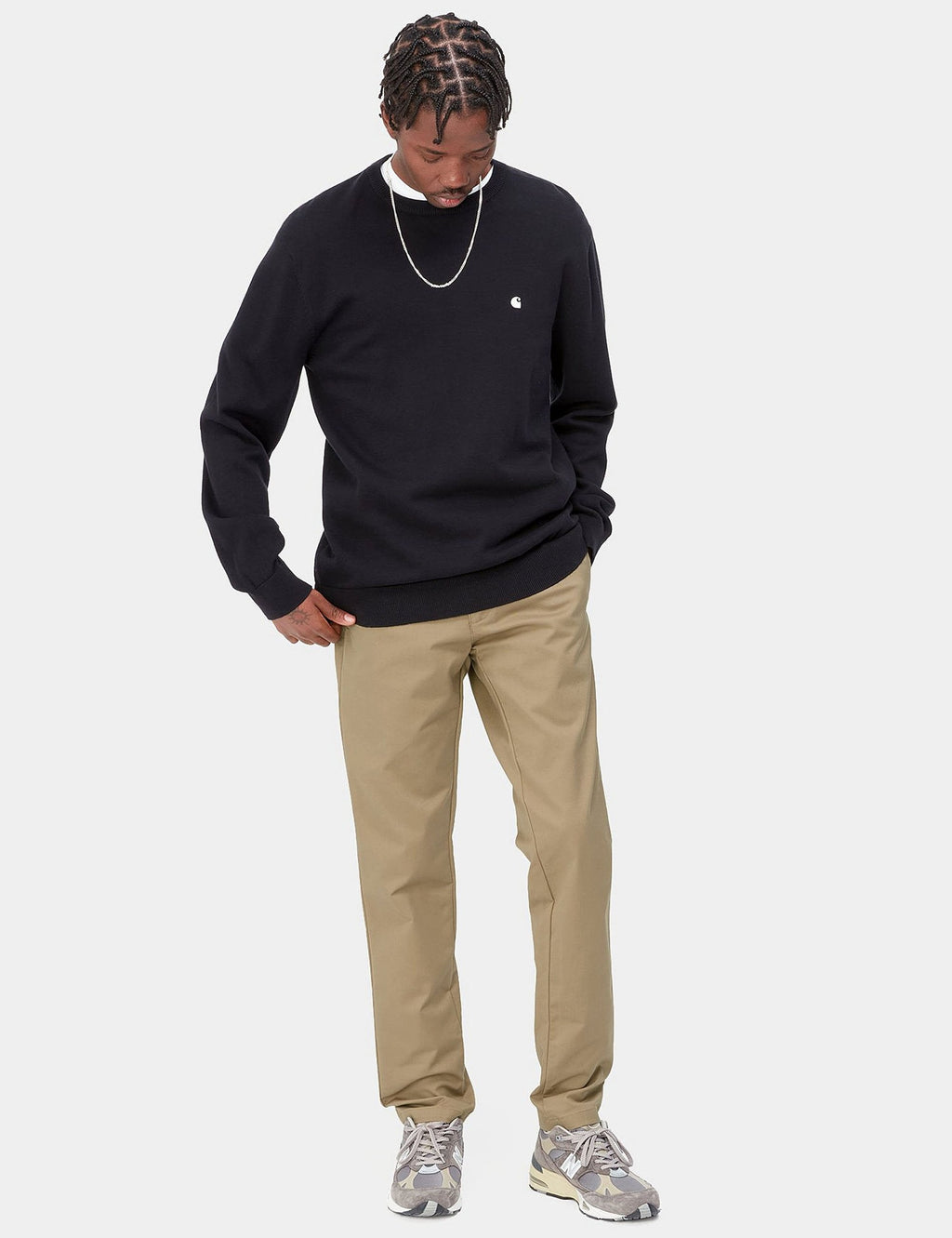 Beige leather Sid pant worn by model, straight leg with cuffed hem