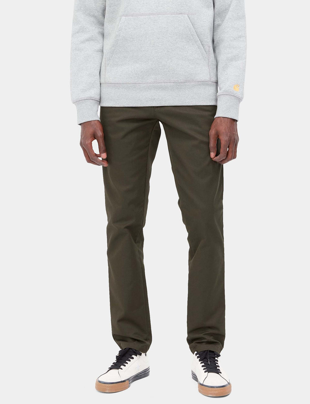 Olive-green straight-leg pants with tapered hem, worn front view.