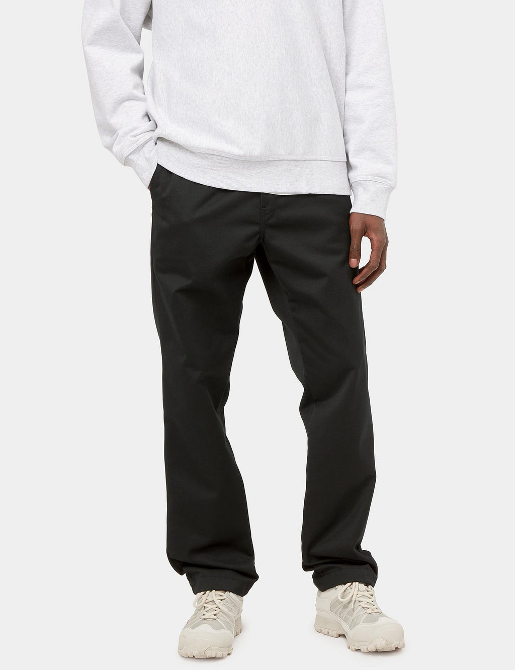 Black trousers with elastic waist, side pockets, and cuffed ankle hem