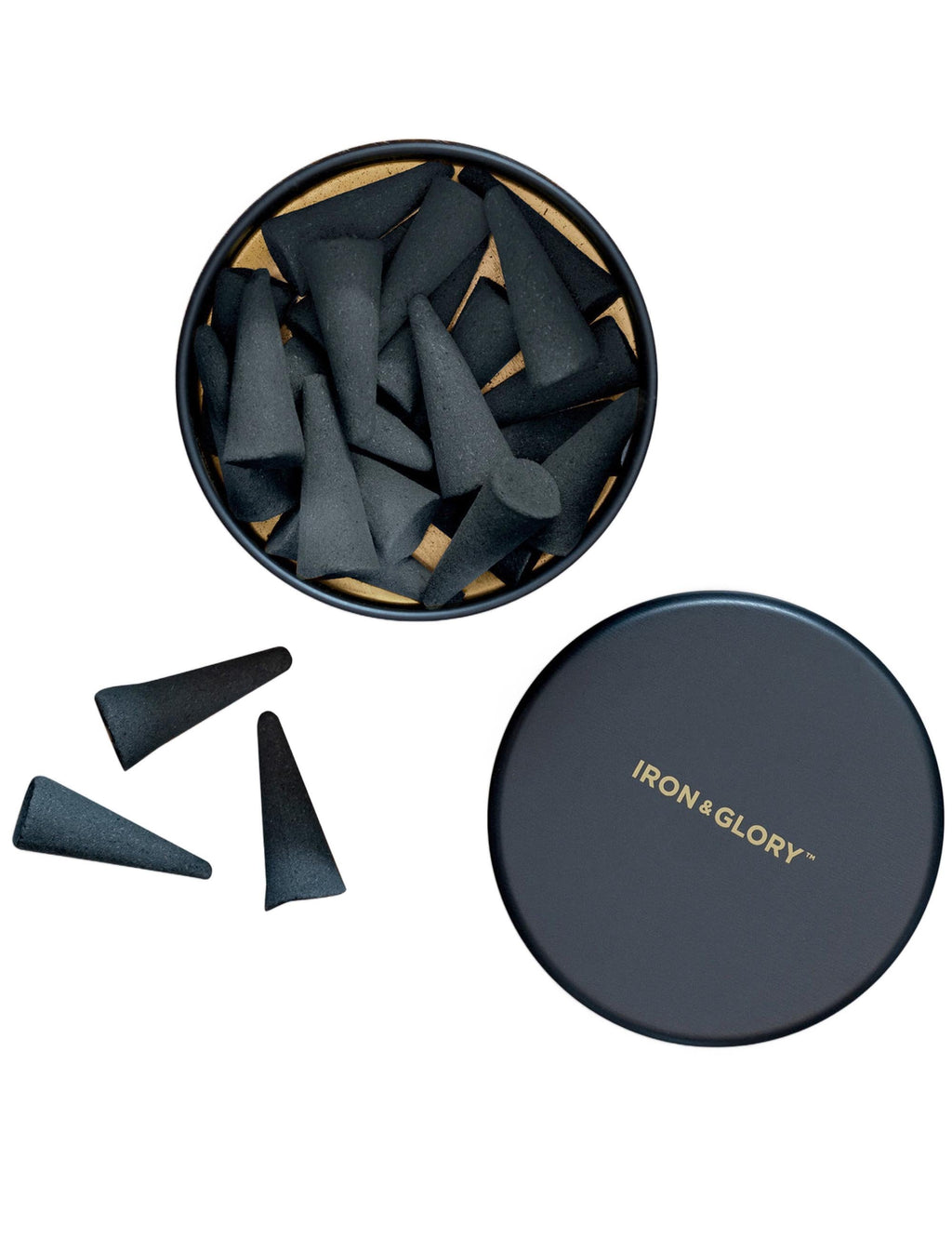 Incense cone set in round open tin with several dark cones and a closed lid