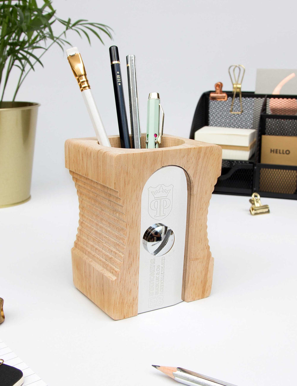Light wood desk tidy with pencil slots and built-in metal sharpener window