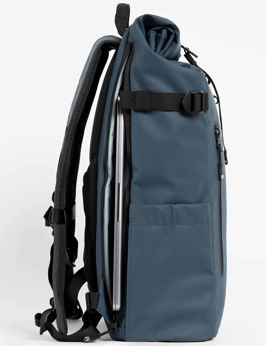 Roll-top backpack side view with padded straps and front zip-access pocket