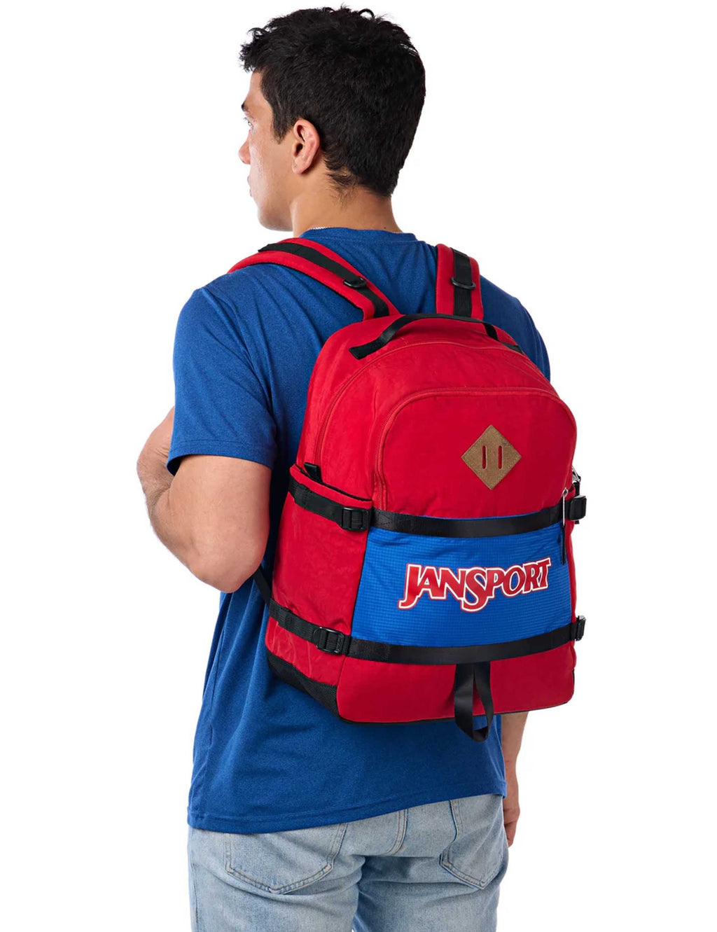 Back view of 27L red backpack with blue waist panel and Jansport logo on front