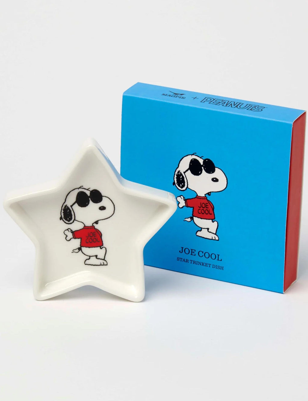 Star-shaped Snoopy trinket dish with Joe Cool print beside blue gift box