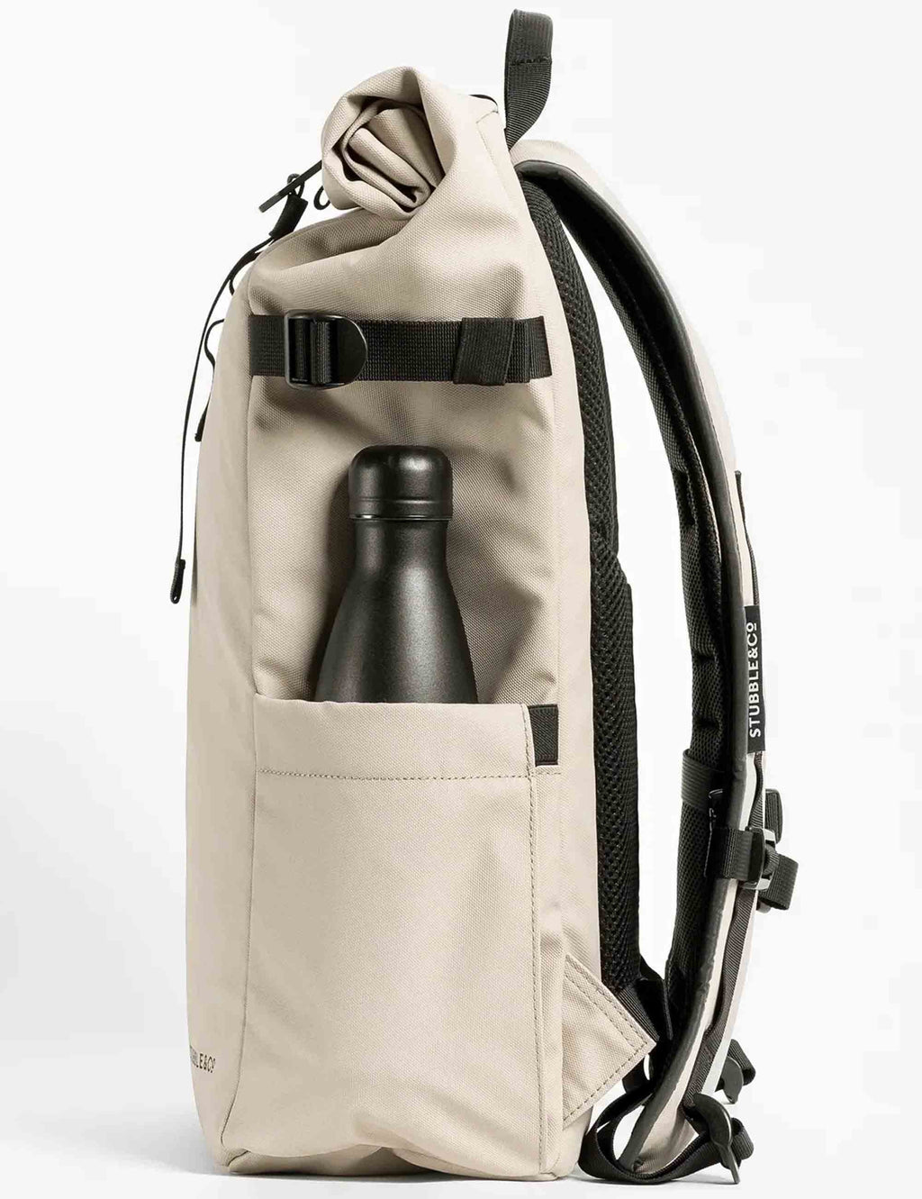 Sand roll-top backpack with water bottle in front pocket and black webbing straps