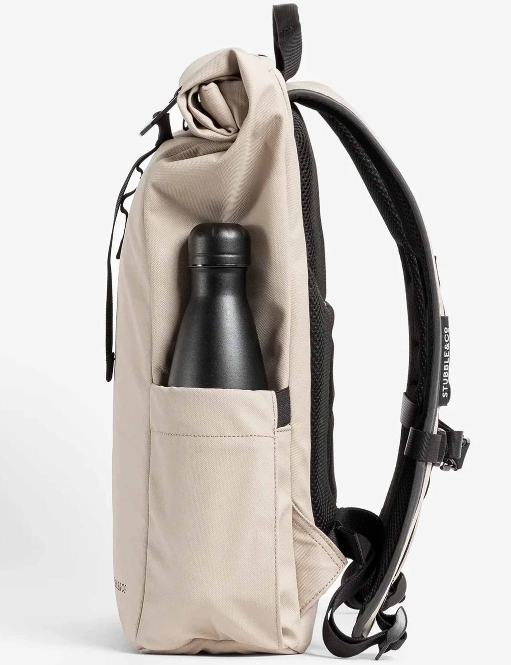 Sand roll-top backpack with roll-top opening and front pocket holding a bottle