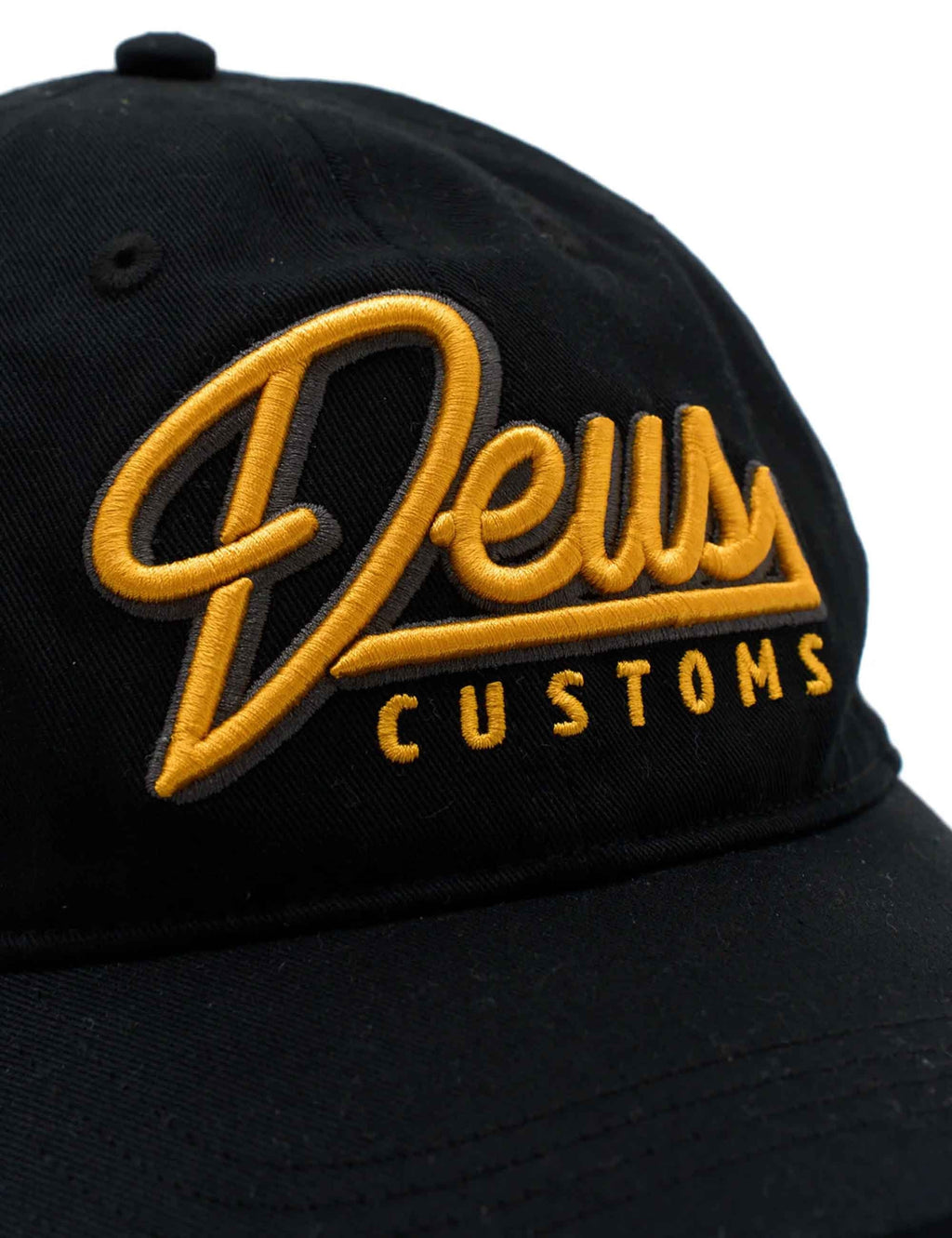 Black cap with large yellow-gold DEUS CUSTOMS logo embroidery
