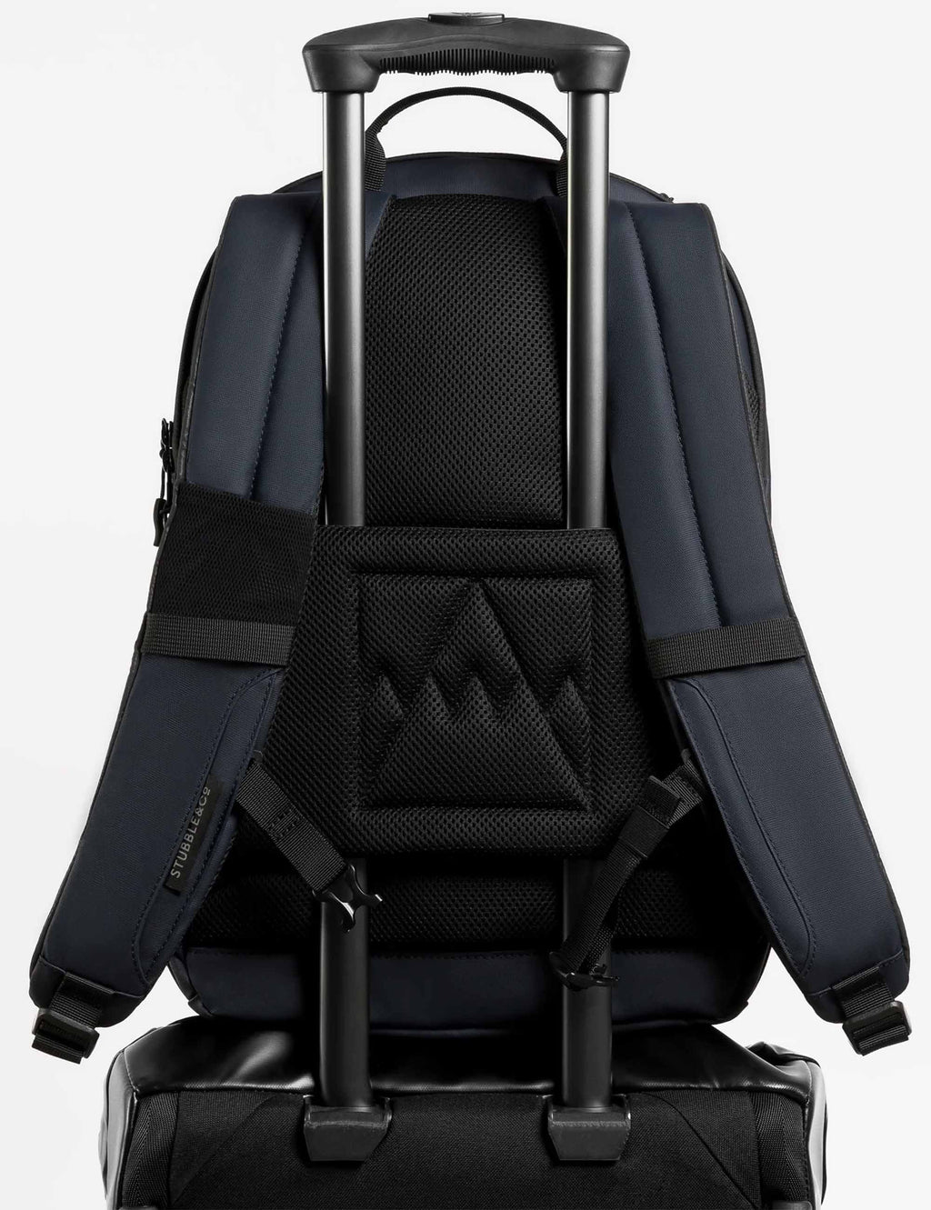 Midnight blue 20L backpack with trolley handle pass-through and cushioned back panel