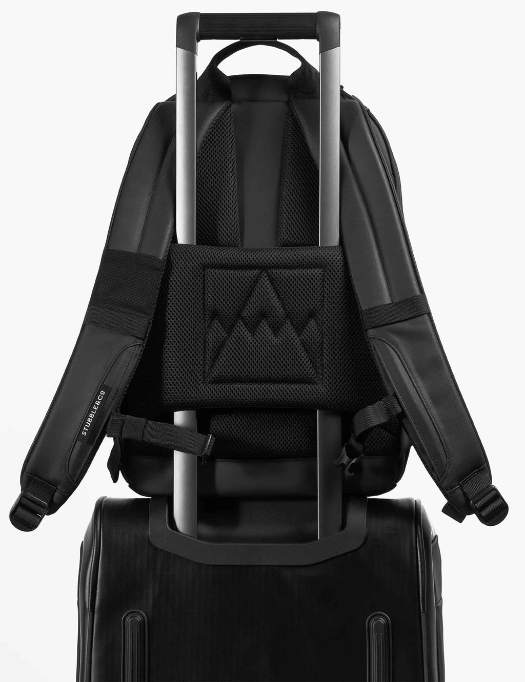All-black backpack with mesh back panel and trolley sleeve over shoulder straps