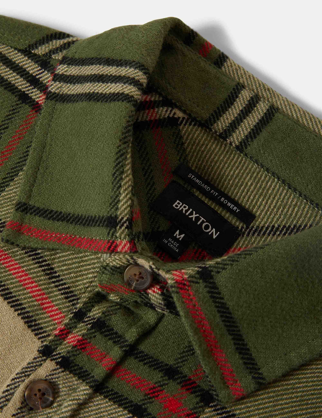 Plaid flannel shirt collar and button placket, green with red and cream stripes