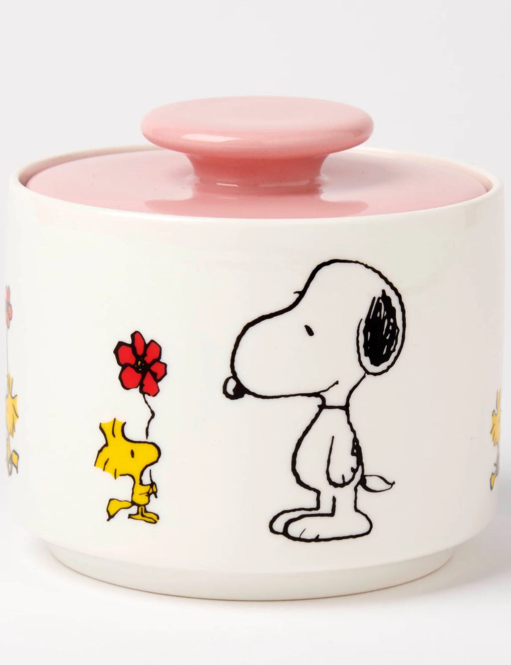 White ceramic candy jar with pink lid, Snoopy and a red flower with yellow bird