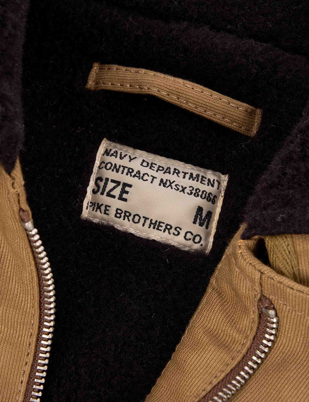 Black interior jacket label reading “NAVY DEPARTMENT” and size “M”