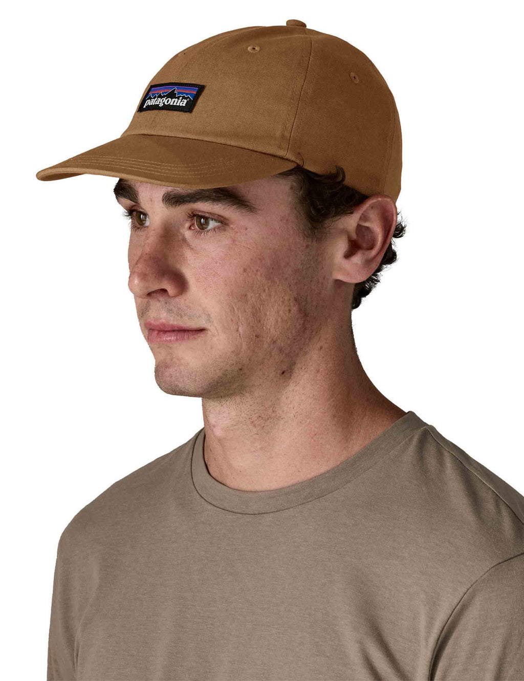 Deer Brown baseball cap with Patagonia patch, worn on a model