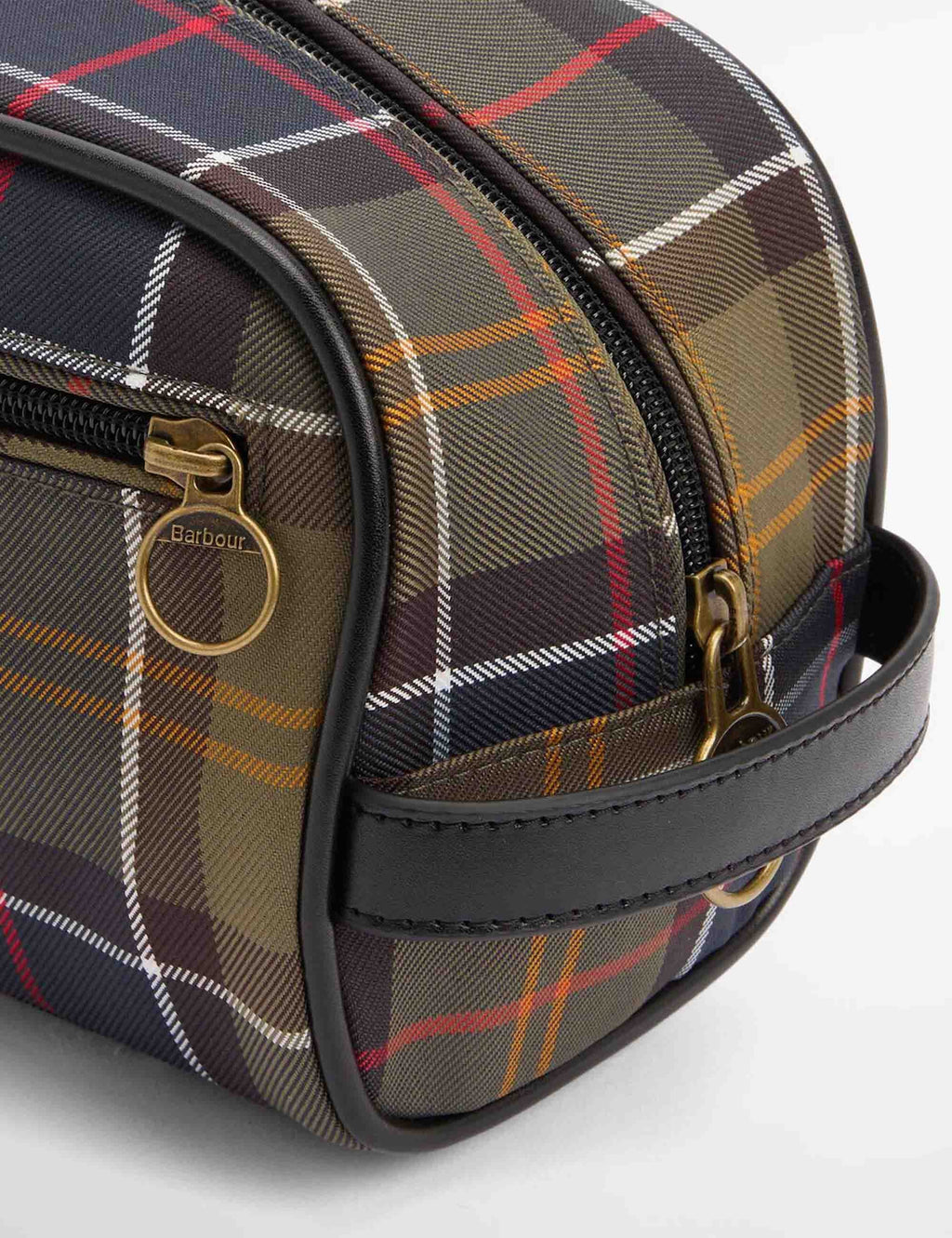 Tartan washbag angled view with plaid fabric, gold-tone zip details and dark trim
