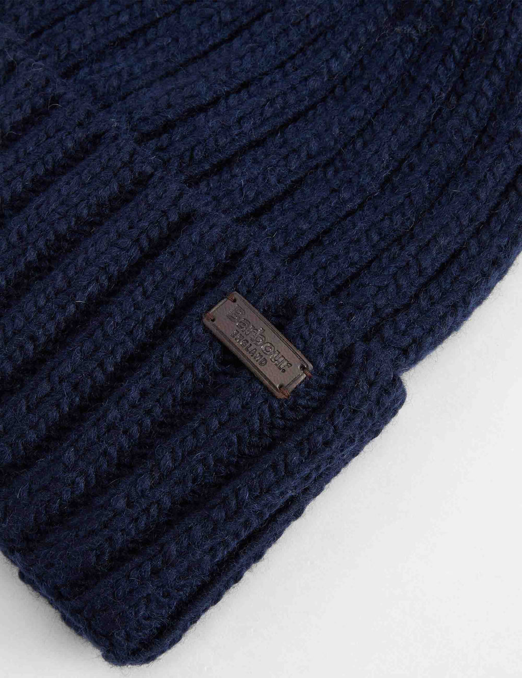 Kelson navy beanie hat close-up, ribbed knit cuff and logo patch