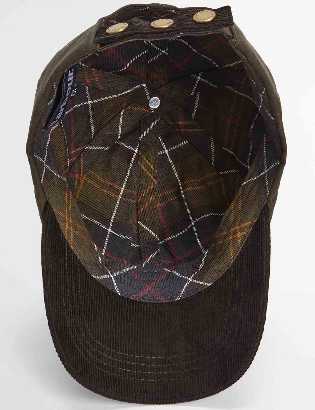 Olive and dark Barbour cap with plaid lining and brass buttons