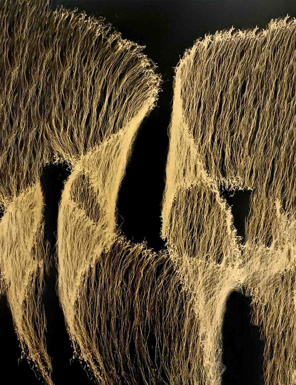 Gold cobweb splatter metallic paint texture on dark surface