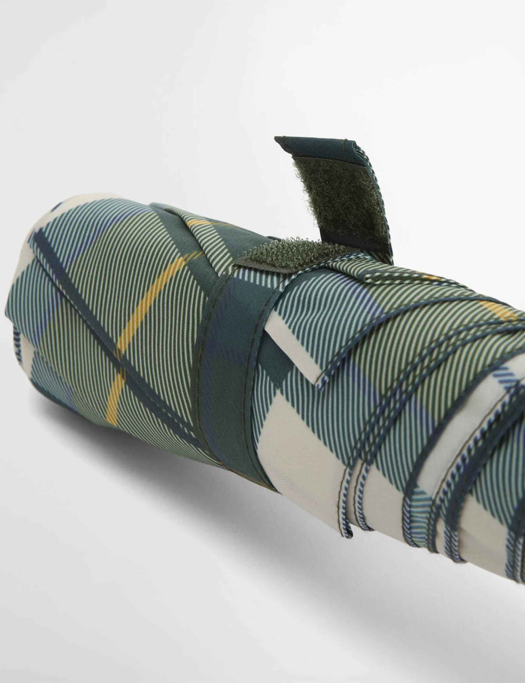 Folded tartan mini umbrella sleeve in dark green and cream check with strap detail
