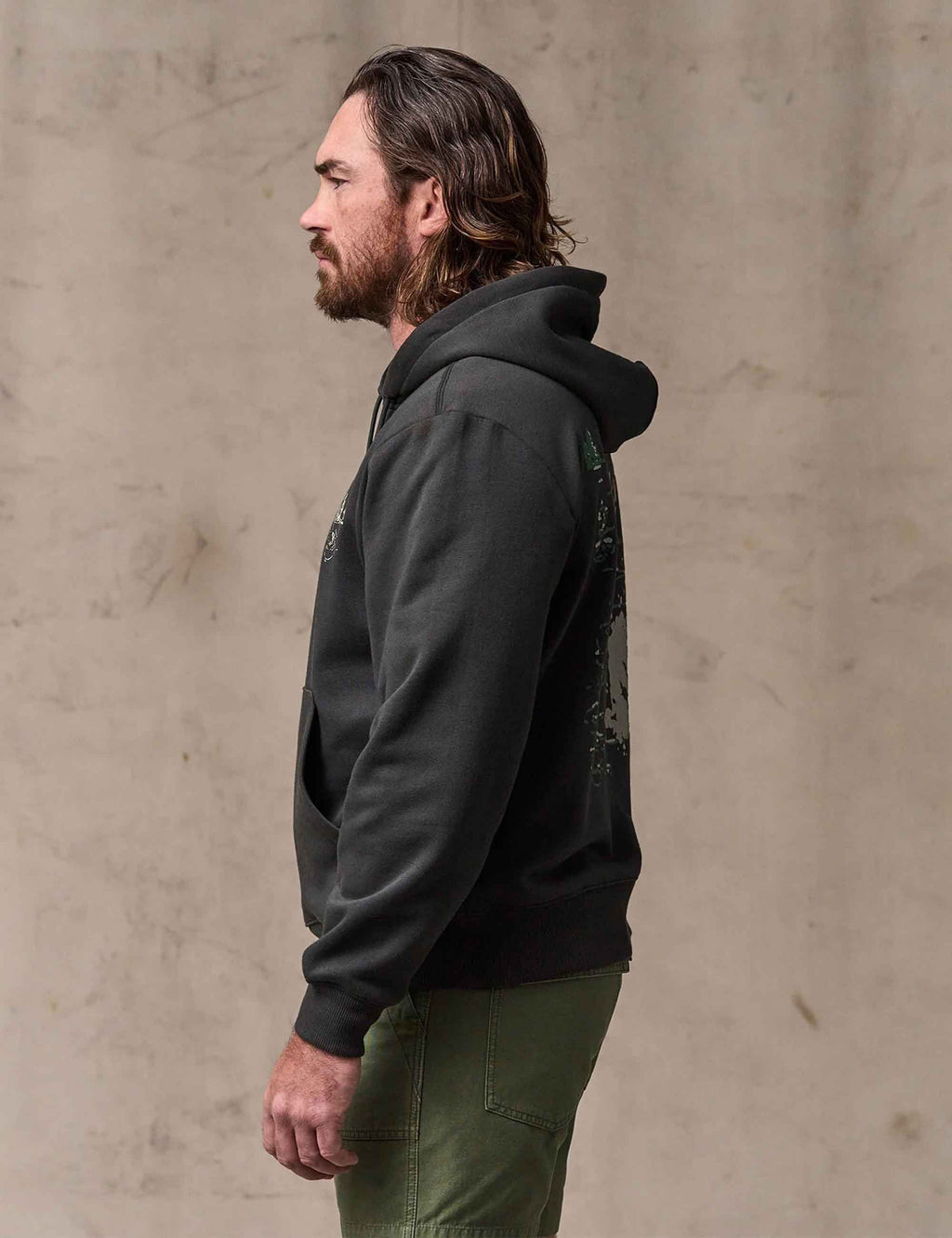 Faded black hoodie sleeve and side profile with pullover hood