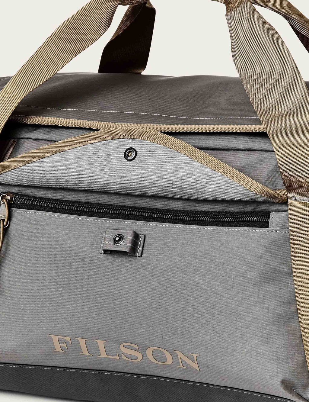 All-weather duffel bag interior, gray lining with top zipper and FILSON patch