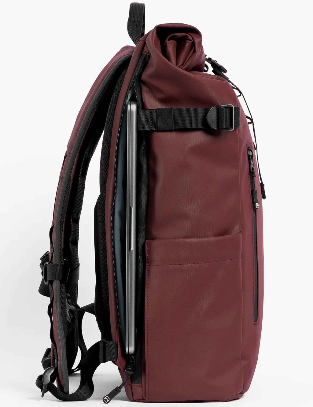 Garnet red roll-top backpack side view with external zipper pocket and black straps