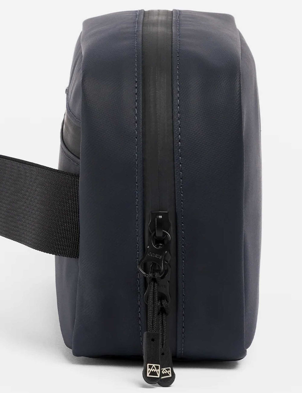 Midnight blue tech bag side view with vertical zipper and black pull tab