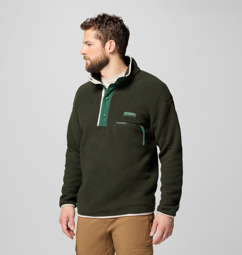 Men's dark green half-snap fleece pullover, side view with chest logo patch