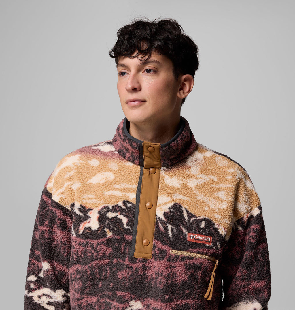 Close-up of camel fleece pullover: tan nylon half-snap placket, stand collar, zip chest pocket, sherpa pile