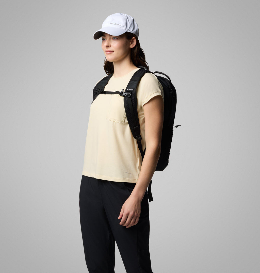 Black 25L backpack worn on the back, side view with padded straps, sternum strap and mesh side pocket