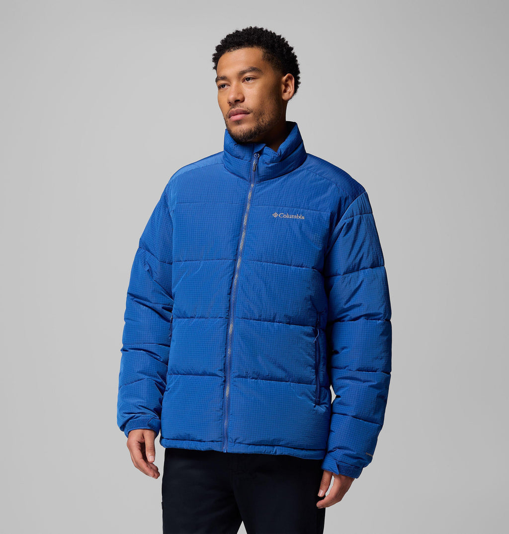 Men's blue puffer jacket with stand collar and full-zip front; chest logo patch.