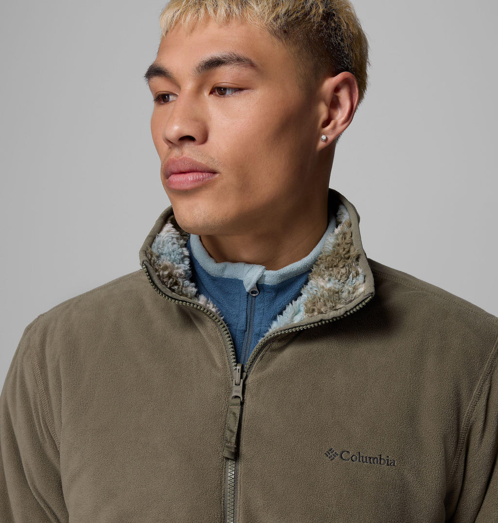 Olive reversible fleece jacket close-up with full zip and blue inner collar lining