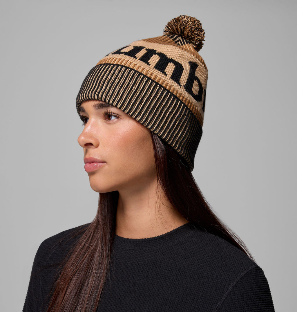 Camel brown beanie with black graphic knit, ribbed cuff, and pom-pom on top