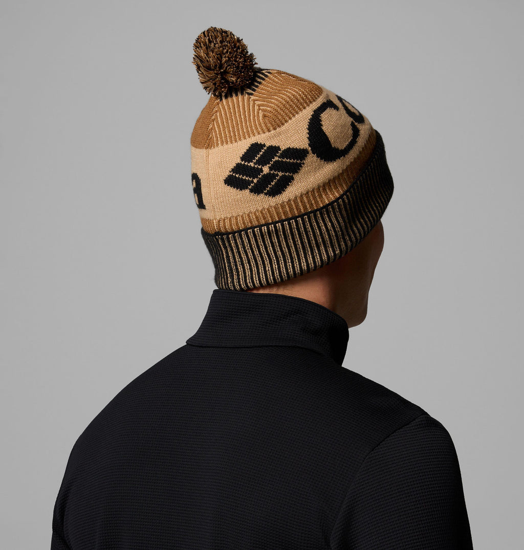 Camel brown beanie with black-striped cuff and pom-pom, knit pattern on side