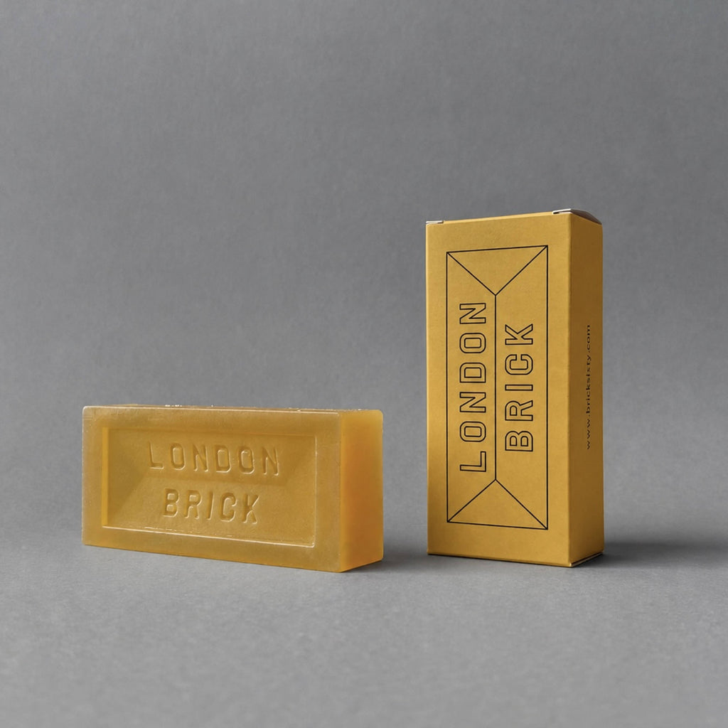 Original Stock soap bar with branded box, rectangular yellow-gold bar.