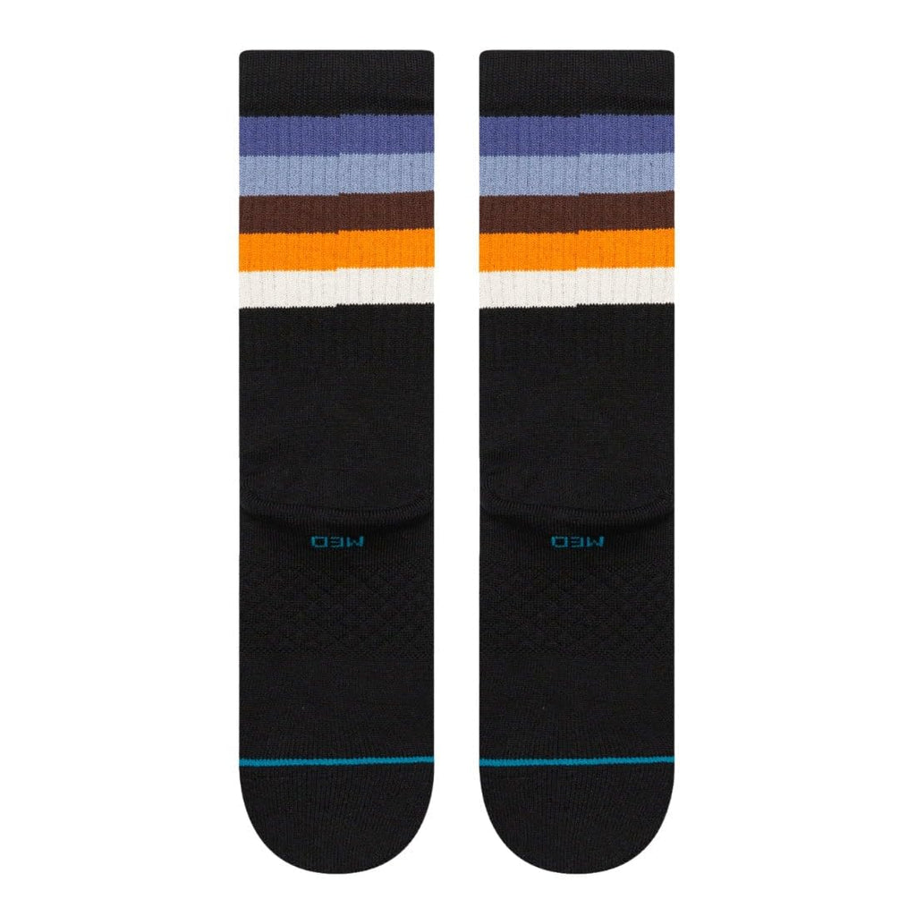 Striped crew socks with black knit, blue cuff trim, orange and white stripe bands
