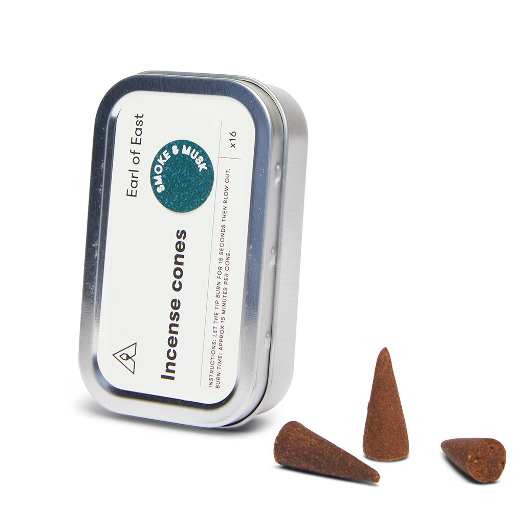 Incense cones tin with label and several dark brown incense cones