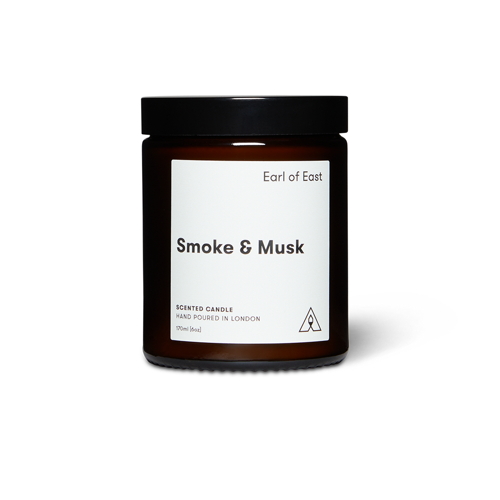 Soy wax scented candle in amber glass jar with black lid, Smoke & Musk label