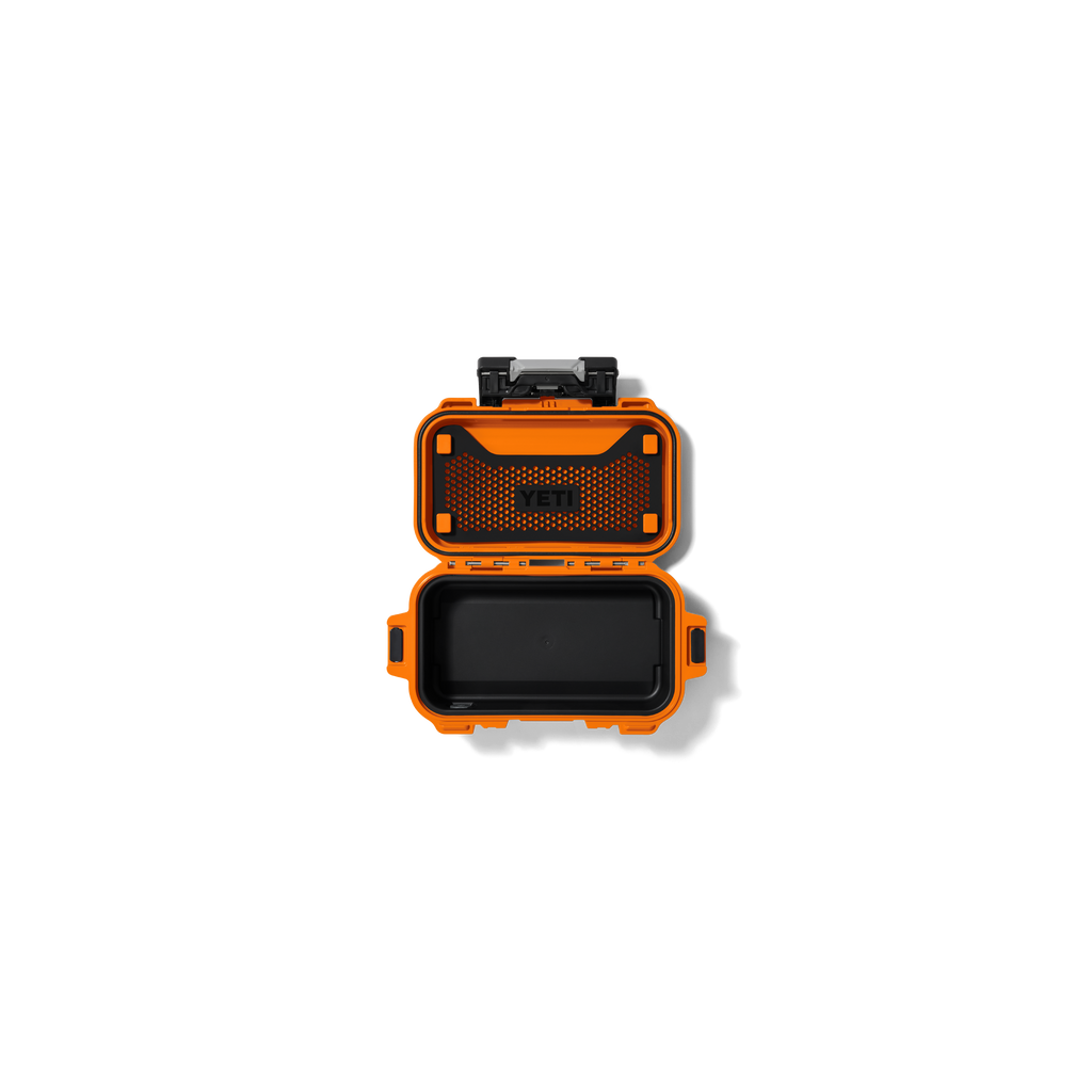 Orange gear case with black front lid and mesh panel, closed