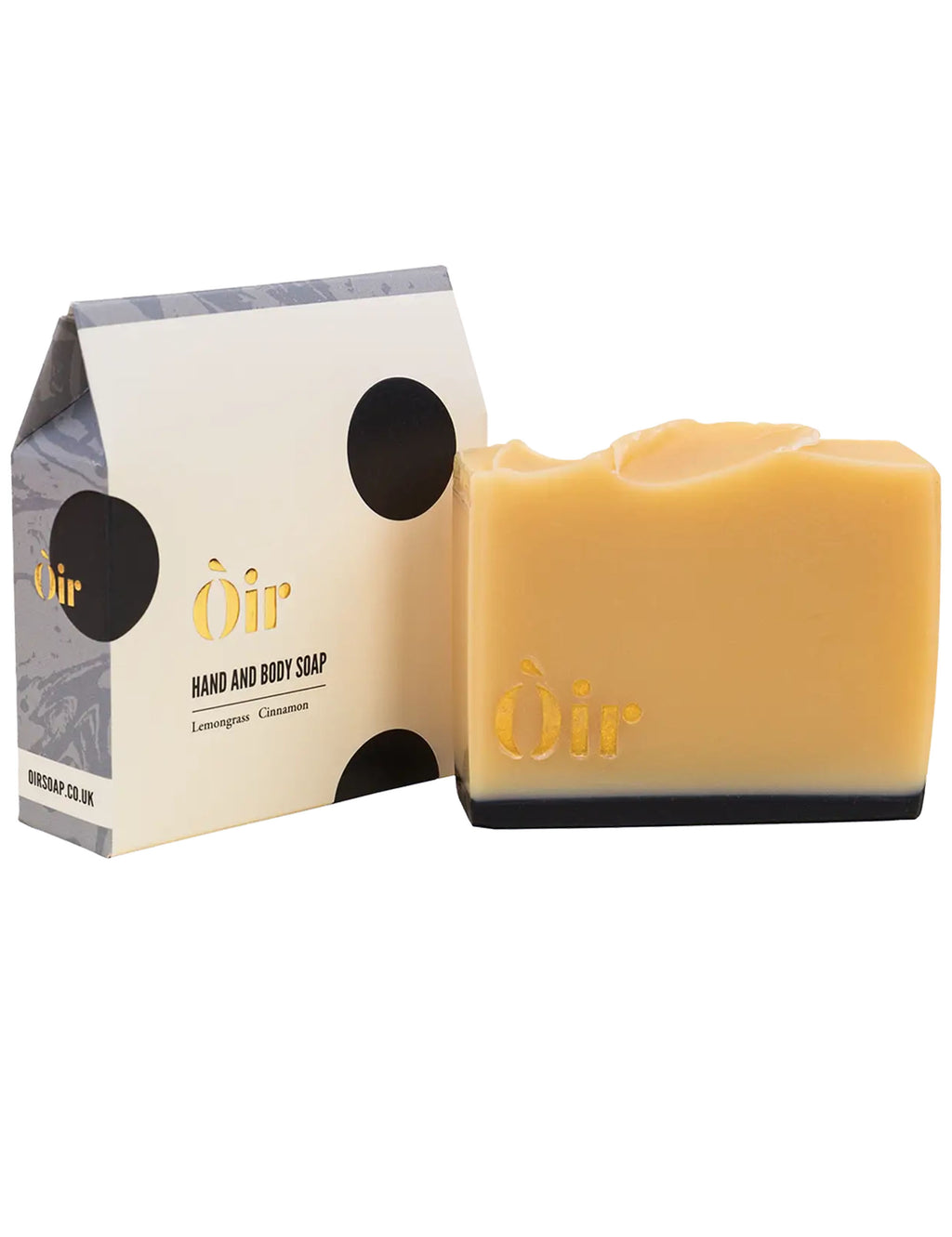 Hand and body soap bar with Oir logo next to a cream-and-black product box