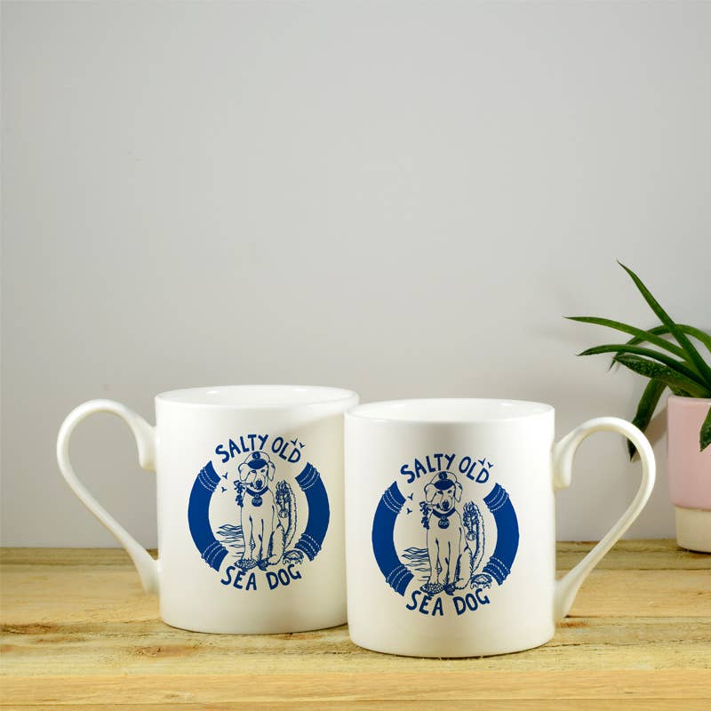 White bone china mugs with blue "Salty Old Sea Dog" logos, pair