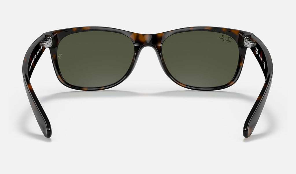 Polished tortoise Wayfarer sunglasses with dark green G-15 lenses and bridge detail