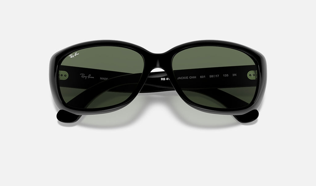 Black sunglasses with dark green lenses, inner branding details visible