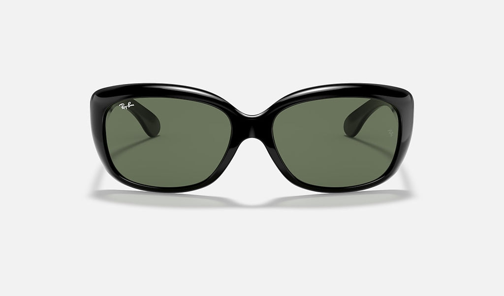 Black sunglasses with dark green lenses and a rounded cat-eye shape