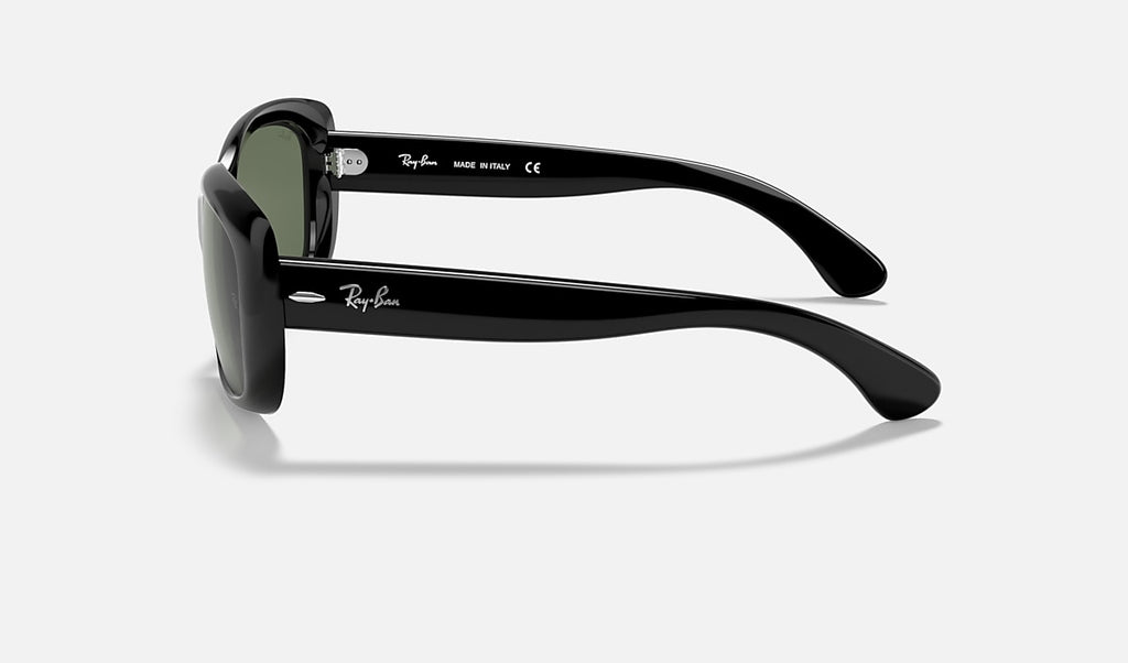 Black sunglasses side view with dark green lenses and slim curved temples