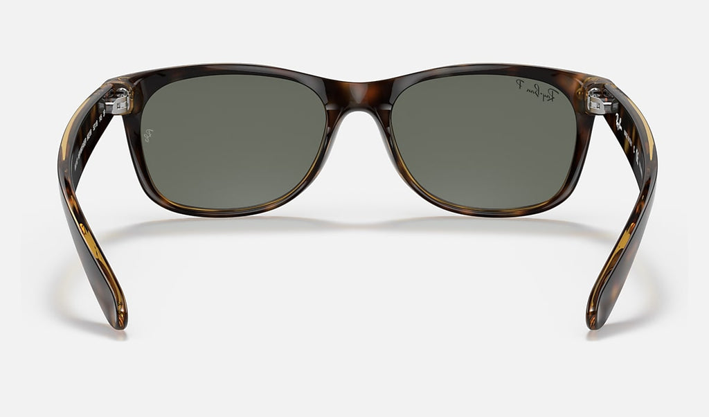 Wayfarer sunglasses front view with polished tortoise frame and green polarized lenses