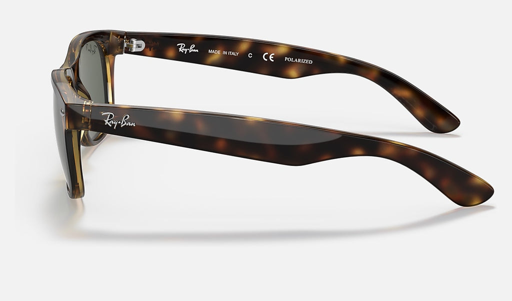 Wayfarer sunglasses side profile with polished tortoise frame and green polarized lenses