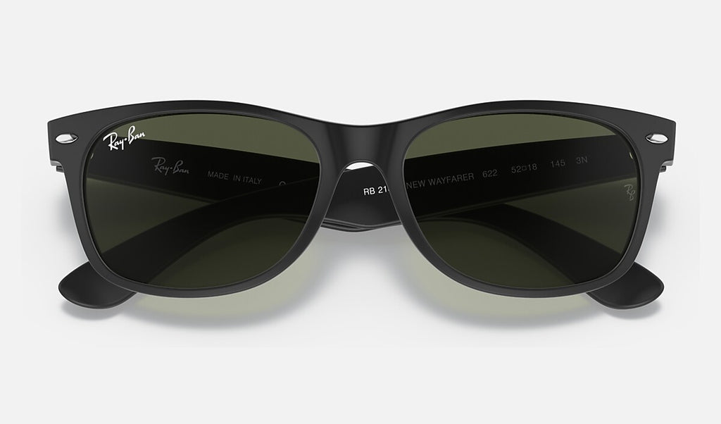 Ray-Ban wayfarer sunglasses top view, matte black frame with green G-15 lenses.